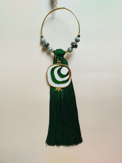 Εικόνα της ΚΡΕΜΑΣΤΟ ΓΟΥΡΙ ΜΕ ΠΡΑΣΙΝΟ ΡΟΔΙ